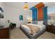 Comfortable bedroom showcasing a large bed, modern lighting, and stylish decor at 420 Burma St, Kissimmee, FL 34747