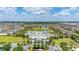 An aerial view showcases the beautiful community center, pools, and water slides in a vibrant neighborhood at 420 Burma St, Kissimmee, FL 34747