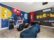 Fun game room features classic arcade games, TV, foosball table and beanbag chairs at 420 Burma St, Kissimmee, FL 34747