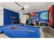 Entertainment room featuring a pool table, air hockey, a foosball table, and video games at 420 Burma St, Kissimmee, FL 34747
