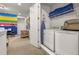 Convenient laundry area adjacent to the living room with modern washer and dryer at 420 Burma St, Kissimmee, FL 34747