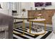 Close up of a coffee table in a well-decorated living room that features modern furnishings and decor, and ample natural light at 420 Burma St, Kissimmee, FL 34747
