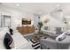 Inviting living room features stylish decor, modern furnishings, contemporary lighting, and a media center with a large TV at 420 Burma St, Kissimmee, FL 34747