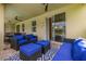 Relaxing patio with comfortable seating, ceiling fans, and pool views at 420 Burma St, Kissimmee, FL 34747