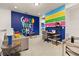 A colorful sitting room featuring a sofa, desk and playful decor at 420 Burma St, Kissimmee, FL 34747