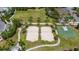 Aerial view of the sand volleyball courts and basketball court, promoting active lifestyles in the community at 420 Burma St, Kissimmee, FL 34747