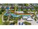 A scenic aerial shot of water slides surrounded by beautifully landscaped homes and amenities at 420 Burma St, Kissimmee, FL 34747