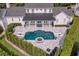 Stunning aerial view of a home with a pool, patio, and landscaped backyard at 423 Arbor Cir, Celebration, FL 34747