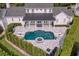 Aerial view of a lovely home with a pool, patio, and beautifully landscaped backyard at 423 Arbor Cir, Celebration, FL 34747
