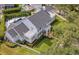 Aerial view of a gorgeous landscaped home with a pool and outdoor living space at 423 Arbor Cir, Celebration, FL 34747