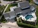 Aerial view of home featuring a backyard pool and a spacious patio at 423 Arbor Cir, Celebration, FL 34747