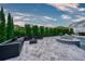 Beautiful outdoor living space showcasing a sleek lounge area and well-manicured landscaping at 423 Arbor Cir, Celebration, FL 34747