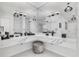 This modern bathroom has marble counters, and sinks, modern lighting, and a nice stool at 423 Arbor Cir, Celebration, FL 34747