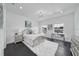 Bright bedroom with dark floors, a bed with plush pillows, and stylish furnishings, under ample natural light at 423 Arbor Cir, Celebration, FL 34747