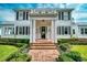 Inviting front entrance with brick steps and classic architectural details at 423 Arbor Cir, Celebration, FL 34747