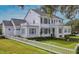 Expansive lawn and manicured hedges accent this home's exterior at 423 Arbor Cir, Celebration, FL 34747