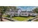 Expansive lawn and manicured hedges accent this home's exterior at 423 Arbor Cir, Celebration, FL 34747
