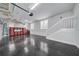 Spacious garage featuring ample storage, epoxy floors, and staircase to the home at 423 Arbor Cir, Celebration, FL 34747