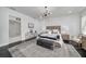 The main bedroom has hardwood floors, a lighting fixture, and a view to the bathroom and shower at 423 Arbor Cir, Celebration, FL 34747
