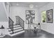 Bright home office area with modern desk, stylish lighting, and staircase at 423 Arbor Cir, Celebration, FL 34747