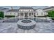 Stunning backyard pool featuring a fire pit, lounge chairs, and covered patio area at 423 Arbor Cir, Celebration, FL 34747
