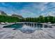 Relaxing pool area with a fire pit and lounge chairs surrounded by lush greenery at 423 Arbor Cir, Celebration, FL 34747