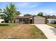 Charming single-story home with a well-maintained lawn and a two-car garage at 4412 Mesa Verde Dr, St Cloud, FL 34769