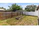 Backyard garden bed with support structure, surrounded by grass and wooden fences at 4412 Mesa Verde Dr, St Cloud, FL 34769