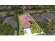 Aerial view showcasing the home's roof, driveway, and landscaping in a residential neighborhood at 5114 Olde Kerry Dr, Orlando, FL 32837