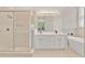 Beautiful bathroom with glass enclosed shower, soaking tub, and double vanity at 5114 Olde Kerry Dr, Orlando, FL 32837