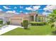 Charming single-Gathering home with a well-manicured lawn, mature landscaping, and a two-car garage at 5114 Olde Kerry Dr, Orlando, FL 32837