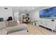 Stylish living room showcasing a comfortable sectional sofa, modern furnishings, and light wood flooring at 5234 Eaglesmere Dr # D04, Orlando, FL 32819