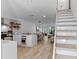 Open floor plan blending the kitchen, dining, and living areas, featuring modern finishes and ample natural light at 5234 Eaglesmere Dr # D04, Orlando, FL 32819