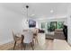 Bright living space with a dining table, a comfortable couch, and large windows offering plenty of natural light at 5234 Eaglesmere Dr # D04, Orlando, FL 32819