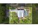 Aerial view of a home with a screened-in pool, solar panels, and private backyard at 5234 Ohio St, Winter Park, FL 32792