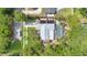 Aerial view of a home featuring solar panels and a screened-in pool at 5234 Ohio St, Winter Park, FL 32792