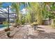 Backyard garden path with lush tropical landscaping and shell accents at 5234 Ohio St, Winter Park, FL 32792