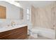 Bathroom featuring modern vanity, a large mirror, and tiled shower and tub at 5234 Ohio St, Winter Park, FL 32792