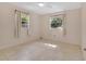 Bright, airy bedroom with neutral walls, tile flooring, and lots of natural light at 5234 Ohio St, Winter Park, FL 32792