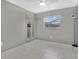 Neutral bedroom with tile floors, gray walls, and double glass door closet at 5234 Ohio St, Winter Park, FL 32792
