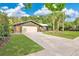 Attractive single-story house with a well-maintained lawn and a long driveway at 5234 Ohio St, Winter Park, FL 32792