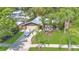 Inviting single-story home featuring a well-manicured lawn and mature tropical landscaping at 5234 Ohio St, Winter Park, FL 32792