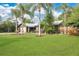 Lovely single-story home with a spacious lawn and palm trees at 5234 Ohio St, Winter Park, FL 32792