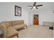 Comfortable tan sofa situated in a cozy living room with tile floors at 5234 Ohio St, Winter Park, FL 32792
