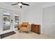 Cozy room with easy access to pool through french doors, a sleek ceiling fan, and tiled floors at 5234 Ohio St, Winter Park, FL 32792