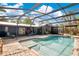 Beautiful pool in screened enclosure surrounded by brick patio at 5234 Ohio St, Winter Park, FL 32792