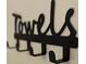 A sign with the word towels and hooks for hanging them at 5245 W Irlo Bronson Memorial Hwy # 148, Kissimmee, FL 34746