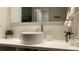 Modern bathroom with round vessel sink, a large mirror and contemporary fixtures at 5245 W Irlo Bronson Memorial Hwy # 148, Kissimmee, FL 34746