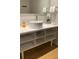 Modern bathroom featuring a vessel sink, vanity with shelves, and hard surface flooring at 5245 W Irlo Bronson Memorial Hwy # 148, Kissimmee, FL 34746
