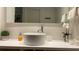 Modern bathroom featuring a vessel sink, vanity, and decorative plants at 5245 W Irlo Bronson Memorial Hwy # 148, Kissimmee, FL 34746